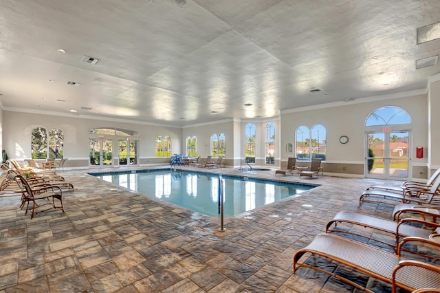 view of swimming pool featuring french doors