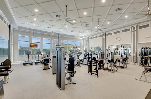 workout area with ceiling fan and light carpet