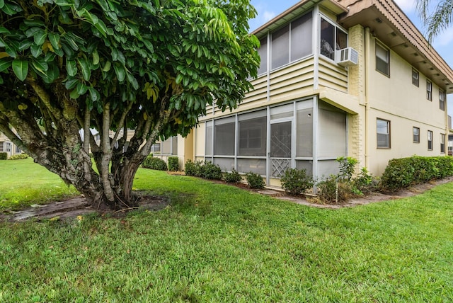 view of side of property with a yard