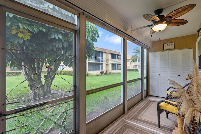 sunroom with plenty of natural light and ceiling fan