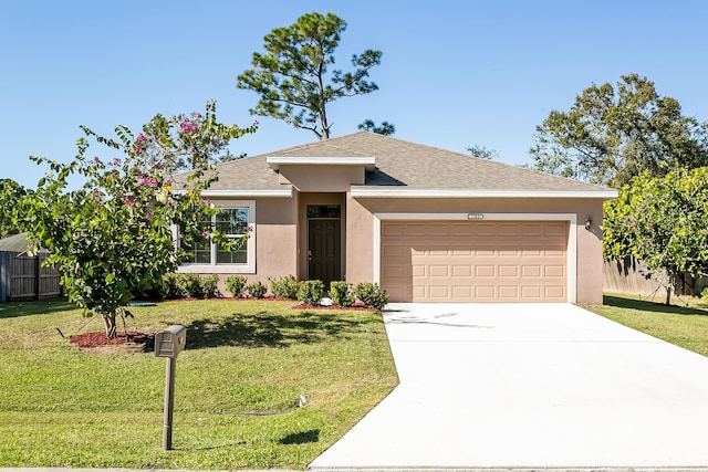 view of front of house featuring a front yard and a garage