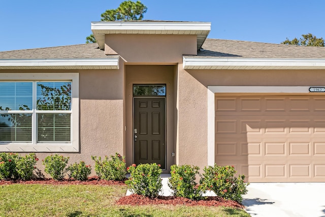 property entrance featuring a garage