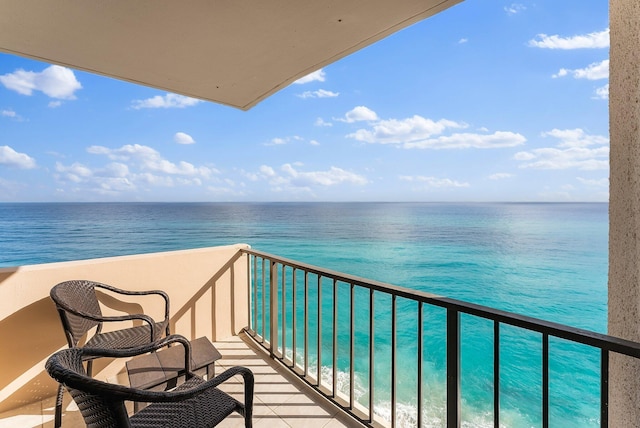 balcony featuring a water view