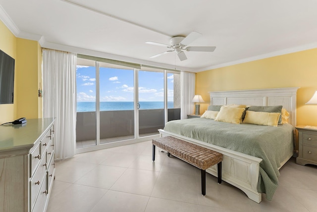 tiled bedroom with access to exterior, ornamental molding, ceiling fan, a water view, and a beach view