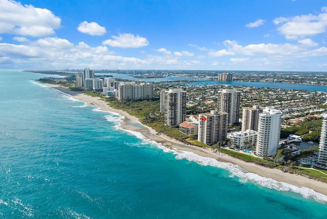 drone / aerial view with a beach view and a water view