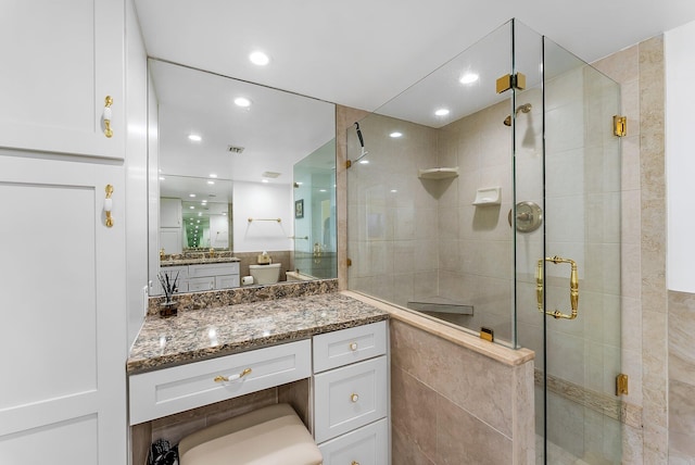 bathroom featuring vanity and walk in shower