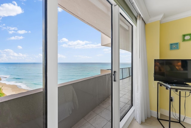 interior space with a beach view and a water view