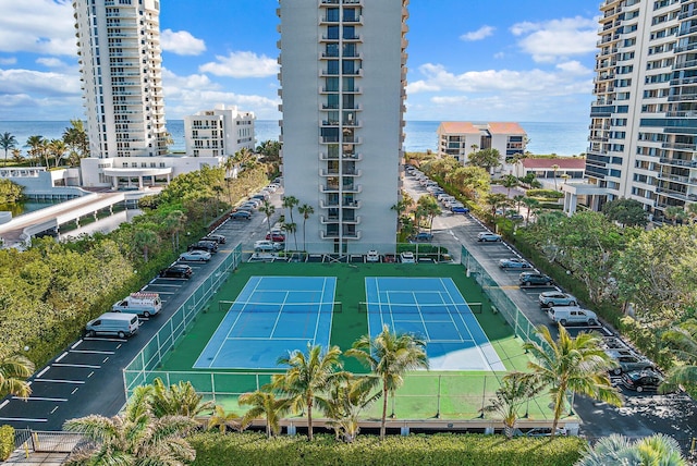 view of sport court featuring a water view