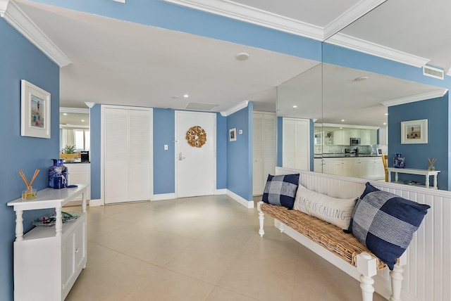 interior space featuring light tile patterned floors and ornamental molding