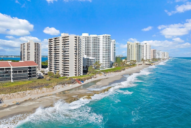 bird's eye view featuring a water view and a view of the beach