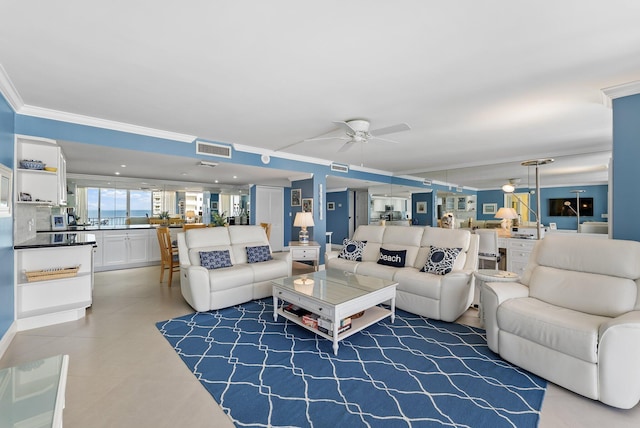 living room featuring ceiling fan and ornamental molding