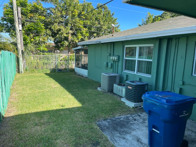 view of yard featuring central air condition unit