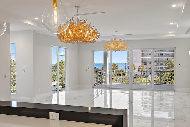 unfurnished dining area featuring an inviting chandelier