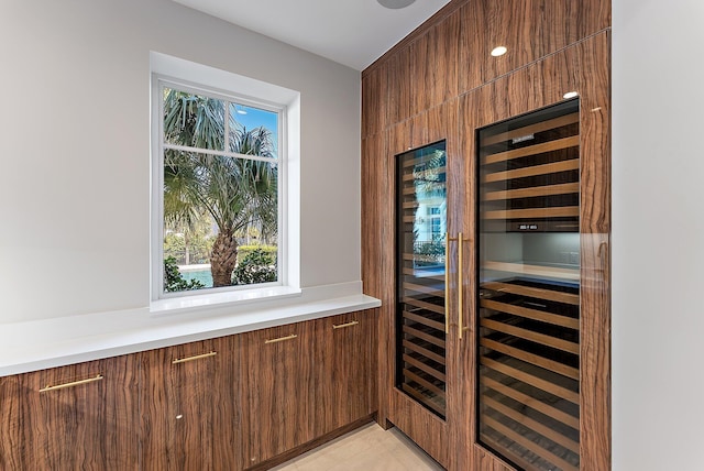 kitchen featuring light tile patterned floors and beverage cooler