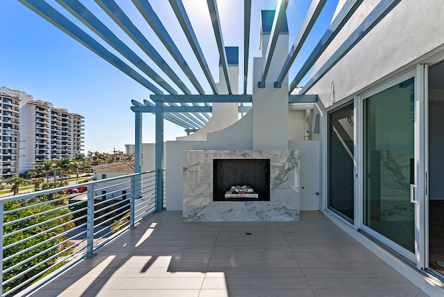 balcony featuring a fireplace