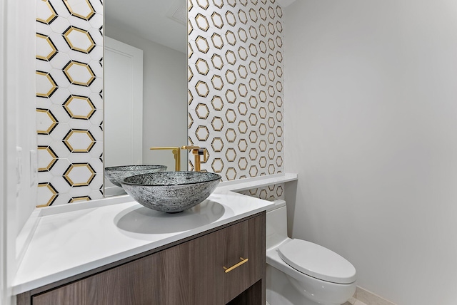 bathroom with vanity and toilet