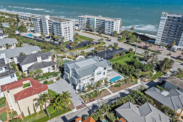 bird's eye view with a water view and a view of the beach