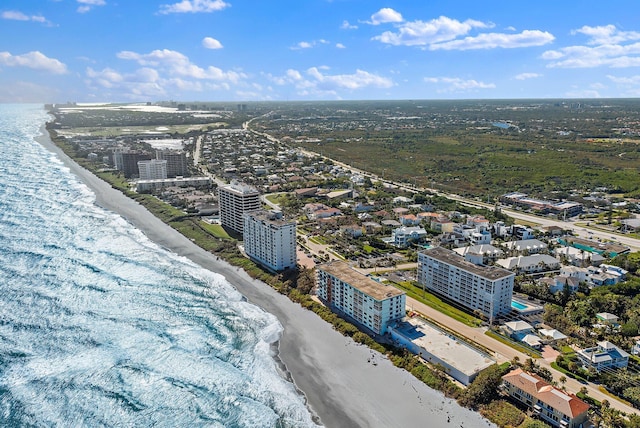 birds eye view of property featuring a view of the beach and a water view