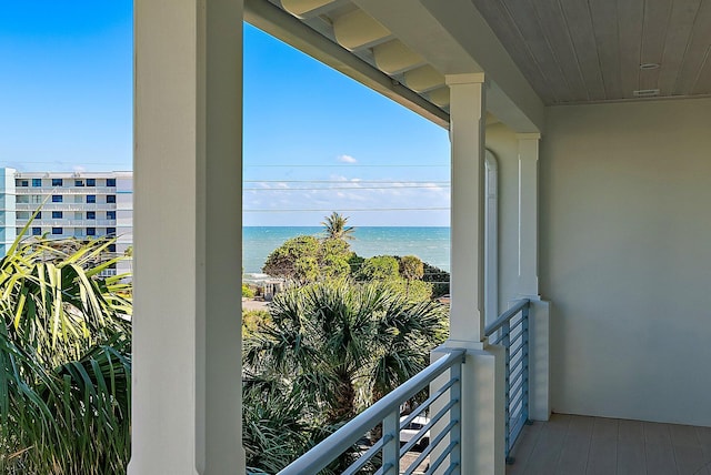 balcony featuring a water view