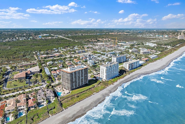 aerial view with a water view and a view of the beach