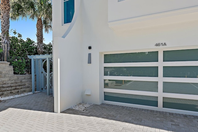 view of exterior entry featuring a garage