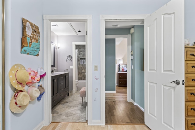 bathroom featuring hardwood / wood-style floors, vanity, and toilet