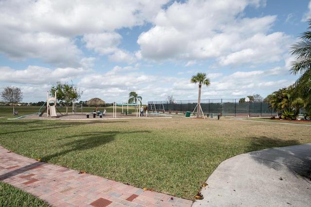 view of playground featuring a lawn