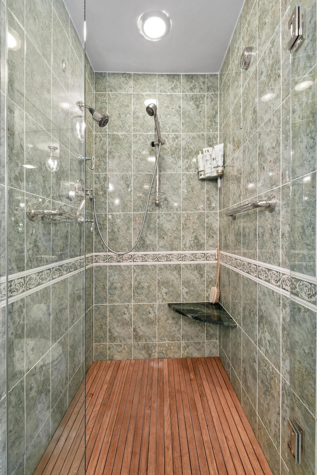 bathroom with tiled shower