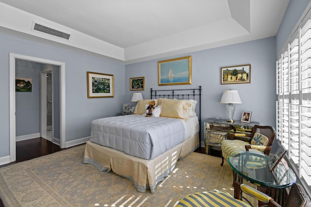 bedroom featuring dark hardwood / wood-style floors