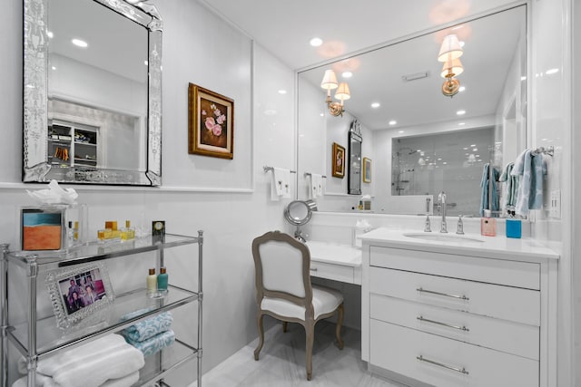 bathroom with vanity and a shower with shower door