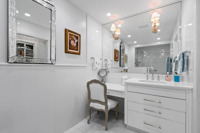 bathroom featuring vanity and a shower with door