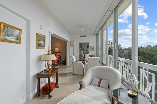 sunroom featuring ceiling fan