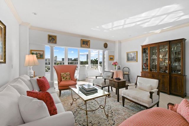 living room with ornamental molding and decorative columns