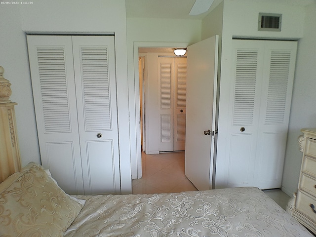 bedroom featuring ceiling fan and light tile patterned floors