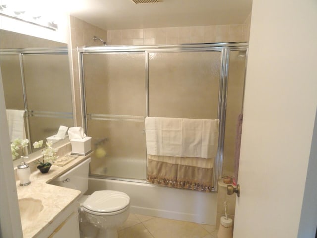 810 Sky Pine Way Unit F2, Greenacres, FL 33415 - full bath with vanity, tile patterned flooring, toilet, and enclosed tub / shower combo
