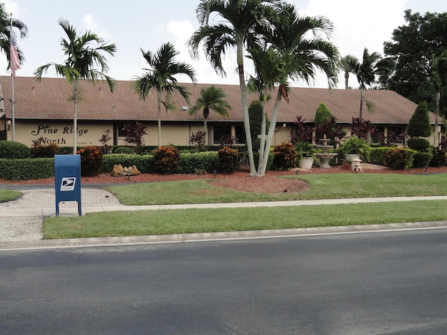 810 Sky Pine Way Unit F2, Greenacres, FL 33415 - view of front of property featuring a front lawn and stucco siding