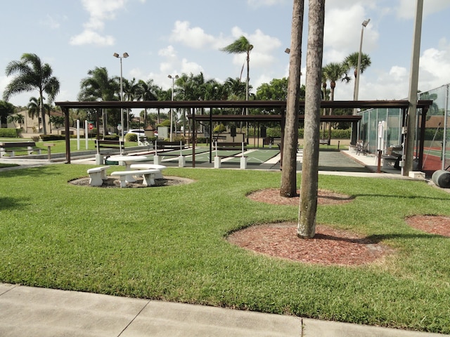 810 Sky Pine Way Unit F2, Greenacres, FL 33415 - view of home's community with a lawn and shuffleboard