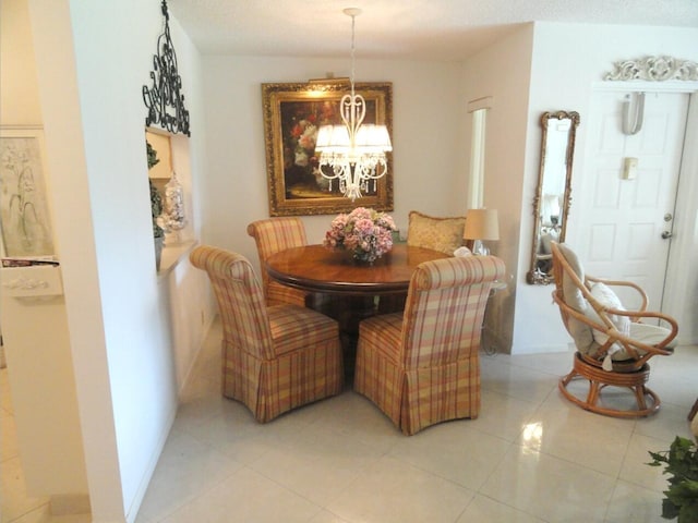 810 Sky Pine Way Unit F2, Greenacres, FL 33415 - dining space featuring a chandelier and light tile patterned floors