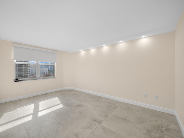 unfurnished room featuring light tile patterned floors