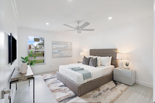 bedroom featuring ceiling fan and crown molding