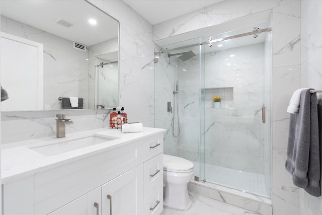 bathroom with vanity, toilet, and an enclosed shower