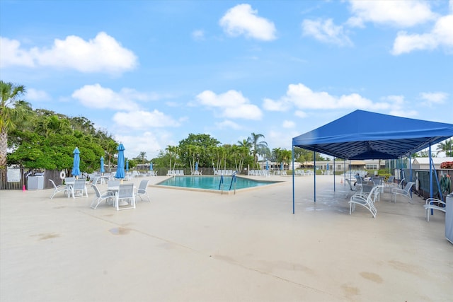 view of swimming pool with a patio area