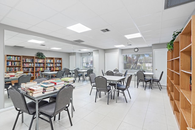 dining space featuring a paneled ceiling