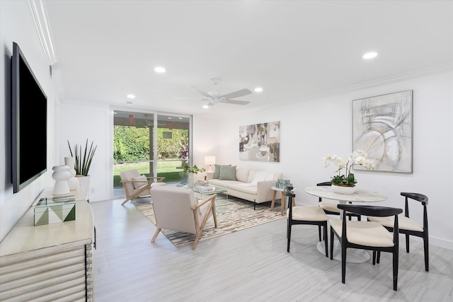 living room with ceiling fan and crown molding