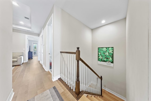 corridor featuring light hardwood / wood-style floors