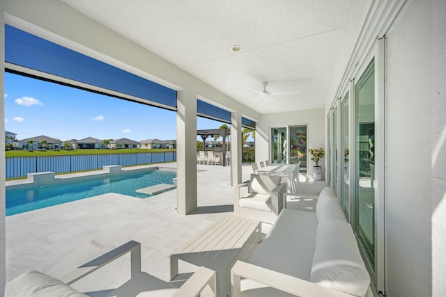 view of pool featuring ceiling fan and a patio area