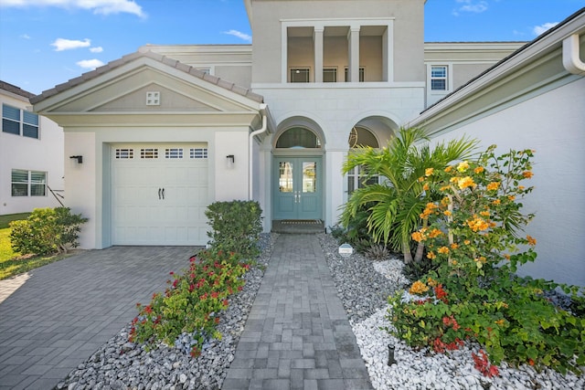 view of front of home featuring a garage and french doors