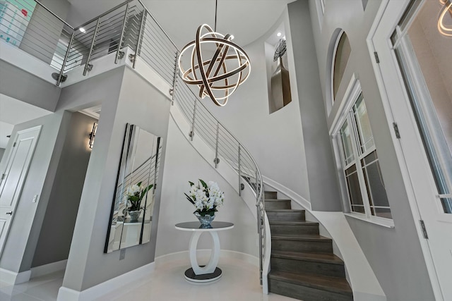 stairs featuring a towering ceiling