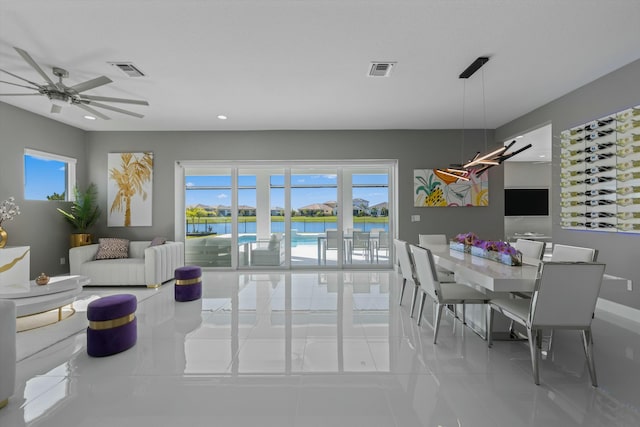 interior space with a wealth of natural light and ceiling fan