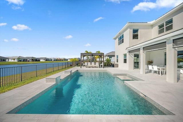 view of pool featuring a jacuzzi, a patio area, and a bar